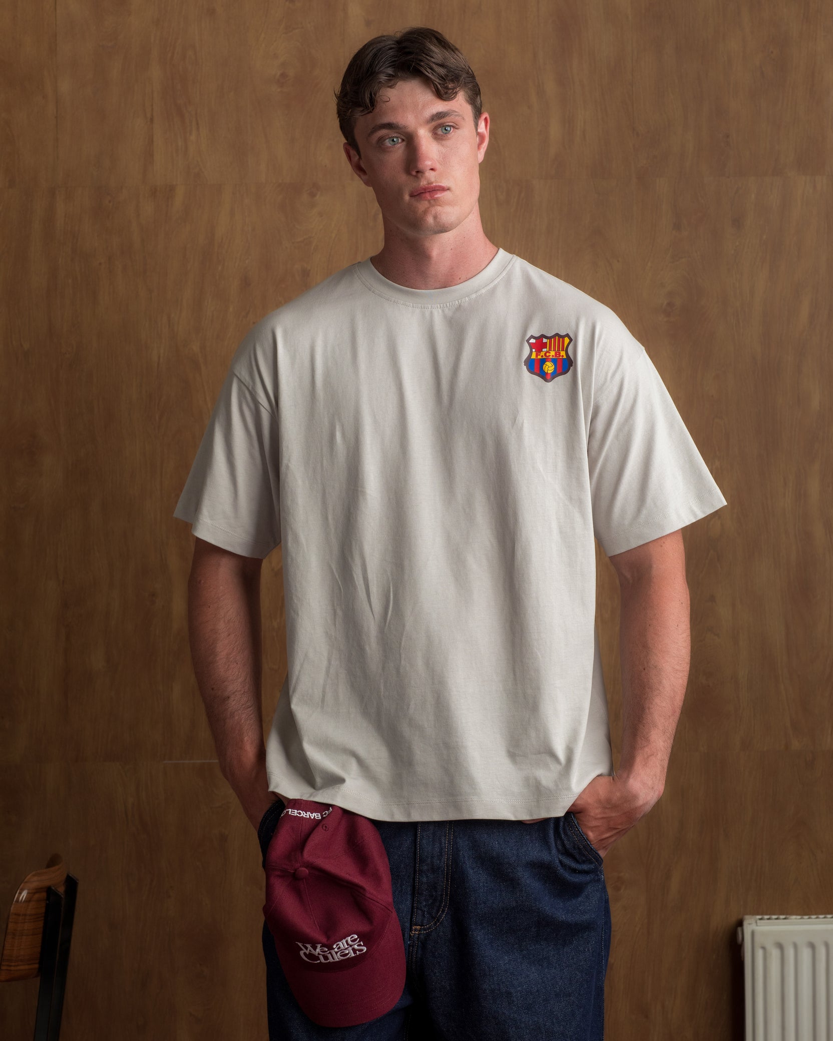 Light grey T-shirt with FC Barcelona crest on the chest.