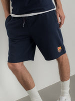 Navy shorts with FC Barcelona crest on the leg