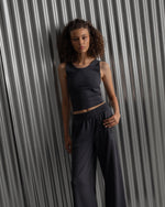 Black ribbed sleeveless crop top featuring the FC Barcelona crest embroidered in the center of the chest.