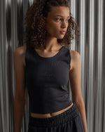 Black ribbed sleeveless crop top featuring the FC Barcelona crest embroidered in the center of the chest.