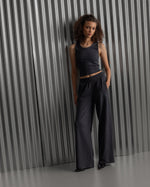 Black ribbed sleeveless crop top featuring the FC Barcelona crest embroidered in the center of the chest.