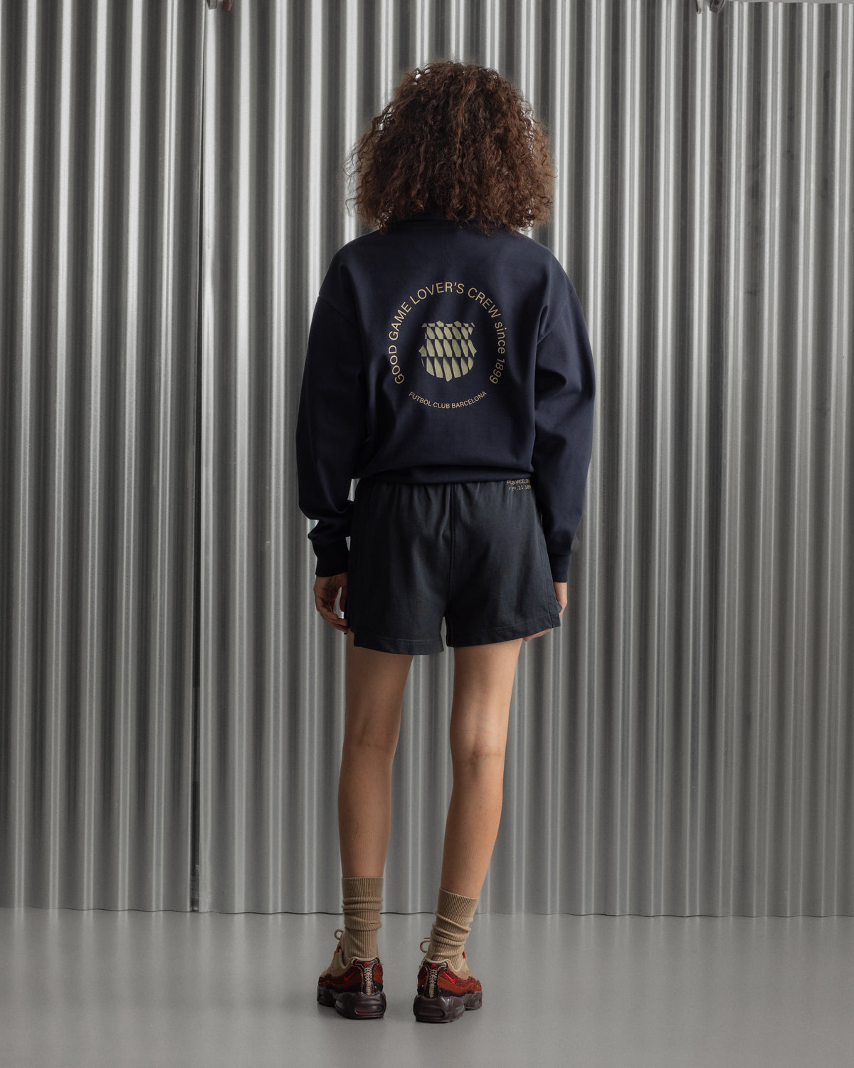 navy FC Barcelona sweatshirt with gold graphic design, club crest, and text 'Good Game Lover’s Crew since 1899'