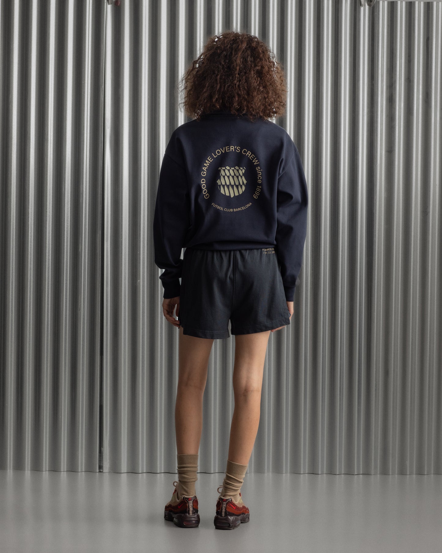 navy FC Barcelona sweatshirt with gold graphic design, club crest, and text 'Good Game Lover’s Crew since 1899'