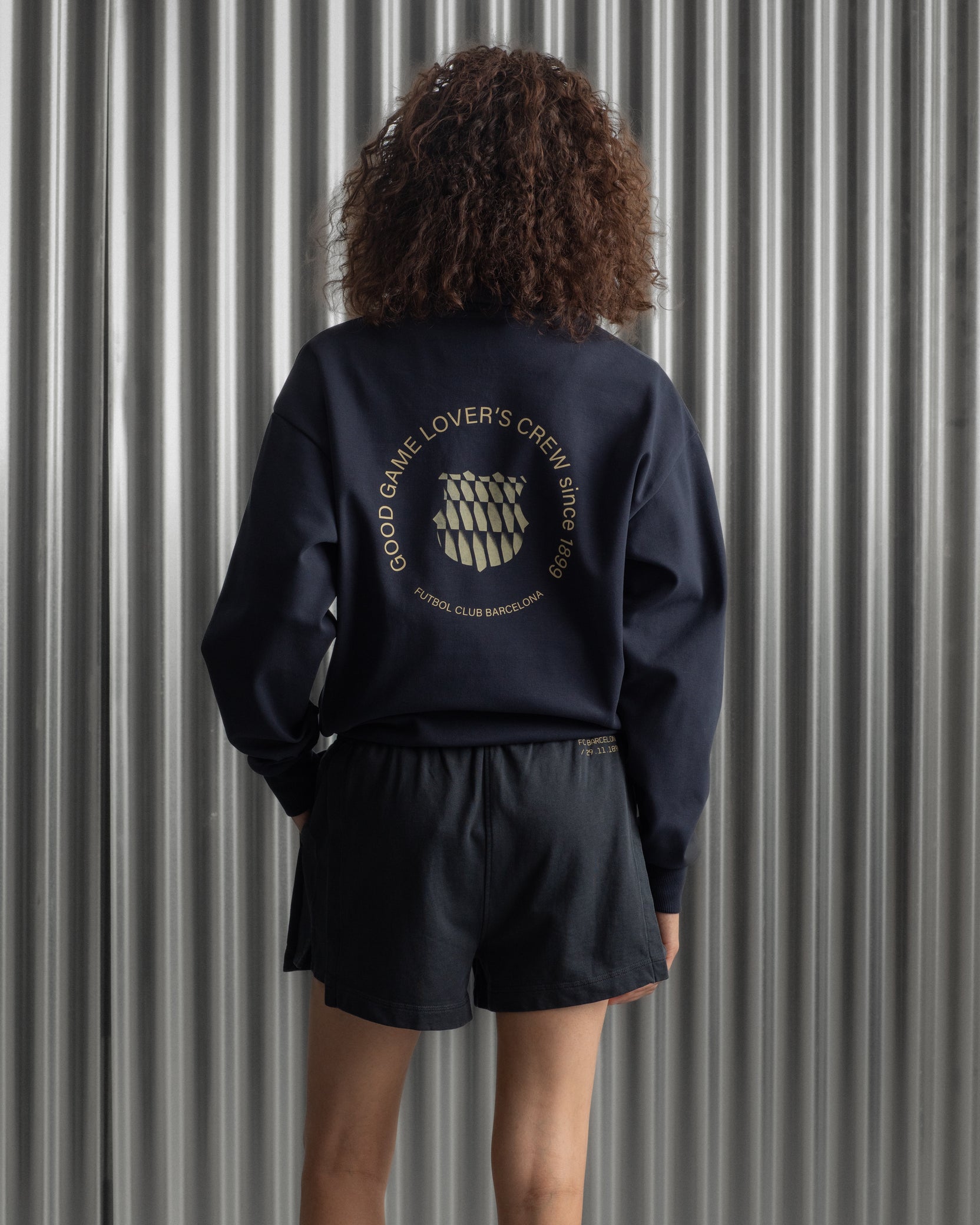 navy FC Barcelona sweatshirt with gold graphic design, club crest, and text 'Good Game Lover’s Crew since 1899'
