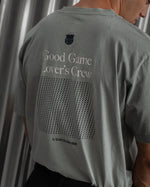gray FC Barcelona t-shirt featuring the club crest, the text "Good Game Lover’s Crew," a dotted square graphic, and "fc BARCELONA 1899" printed at the bottom.