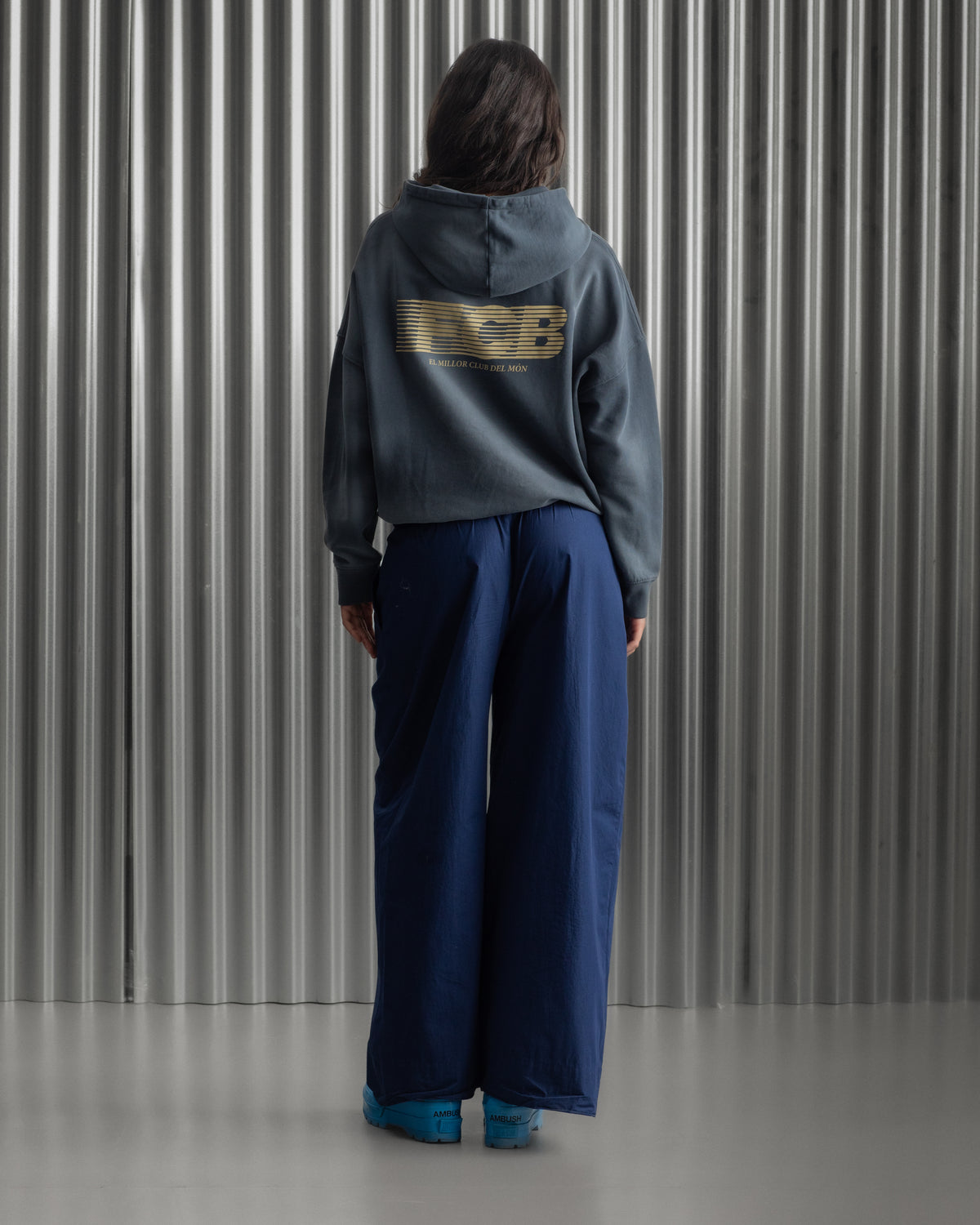 Dark blue FC Barcelona hoodie featuring the club crest and the phrase 'Good Game Lover’s Crew' embroidered on the front.