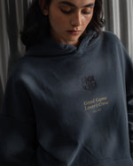 Dark blue FC Barcelona hoodie featuring the club crest and the phrase 'Good Game Lover’s Crew' embroidered on the front.