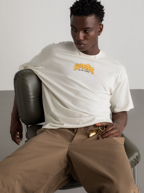 White T-shirt with colorful Barça graphic on the back featuring a football, flags, and dynamic typography
