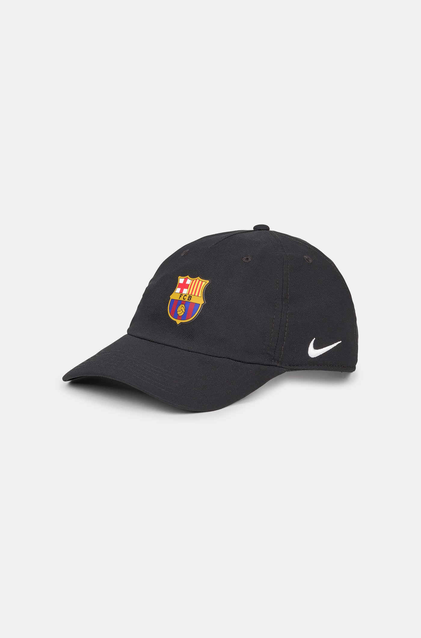 Black curved-brim cap featuring the FC Barcelona crest on the front and a white Nike swoosh embroidered on the side.