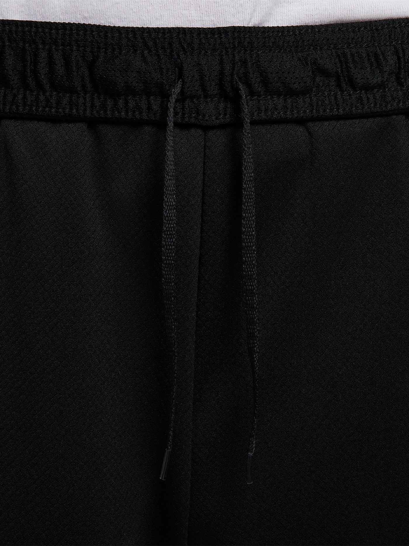 Black FC Barcelona shorts with blue and red side accents, Nike logo and club crest.