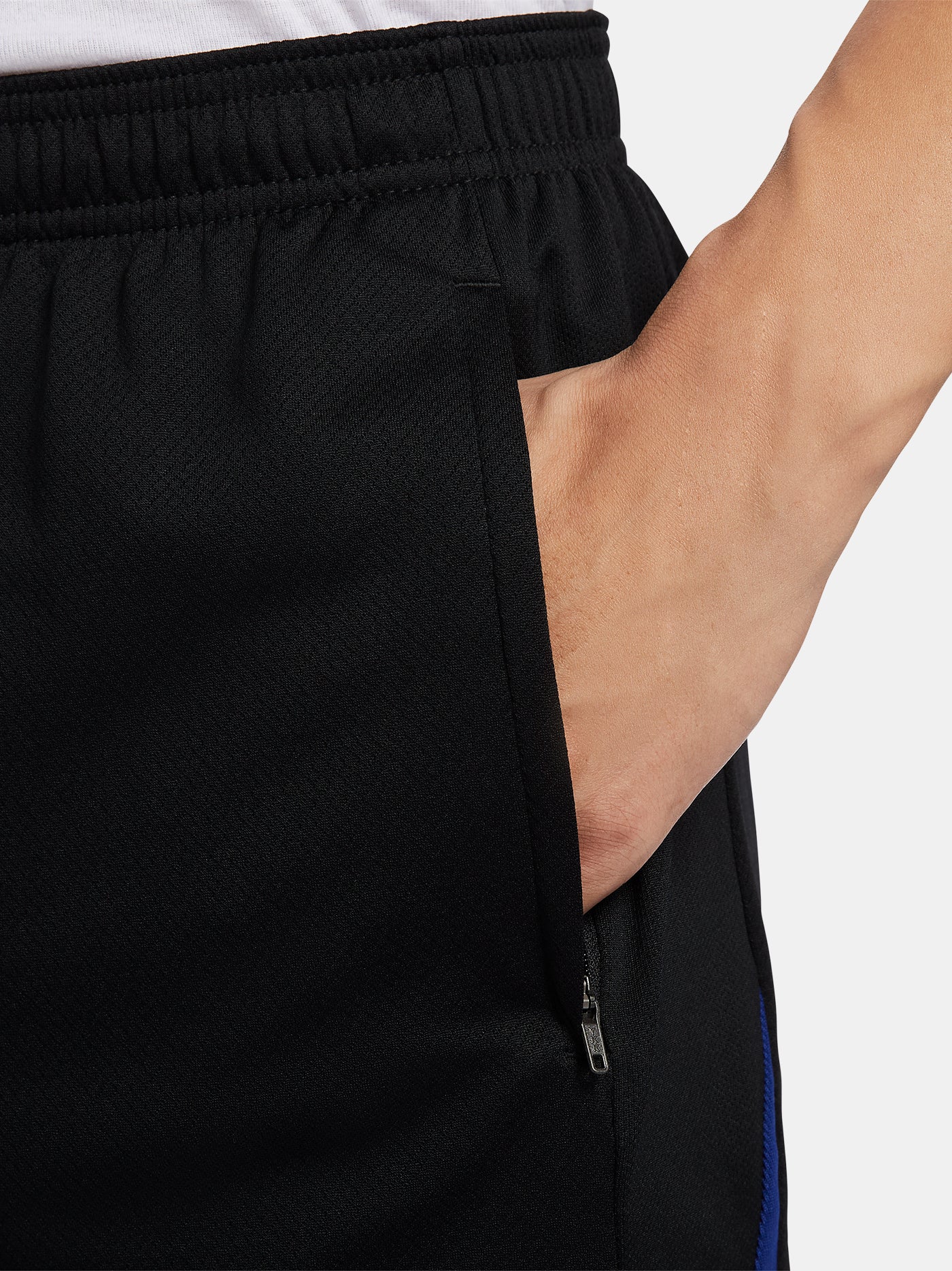 Black FC Barcelona shorts with blue and red side accents, Nike logo and club crest.