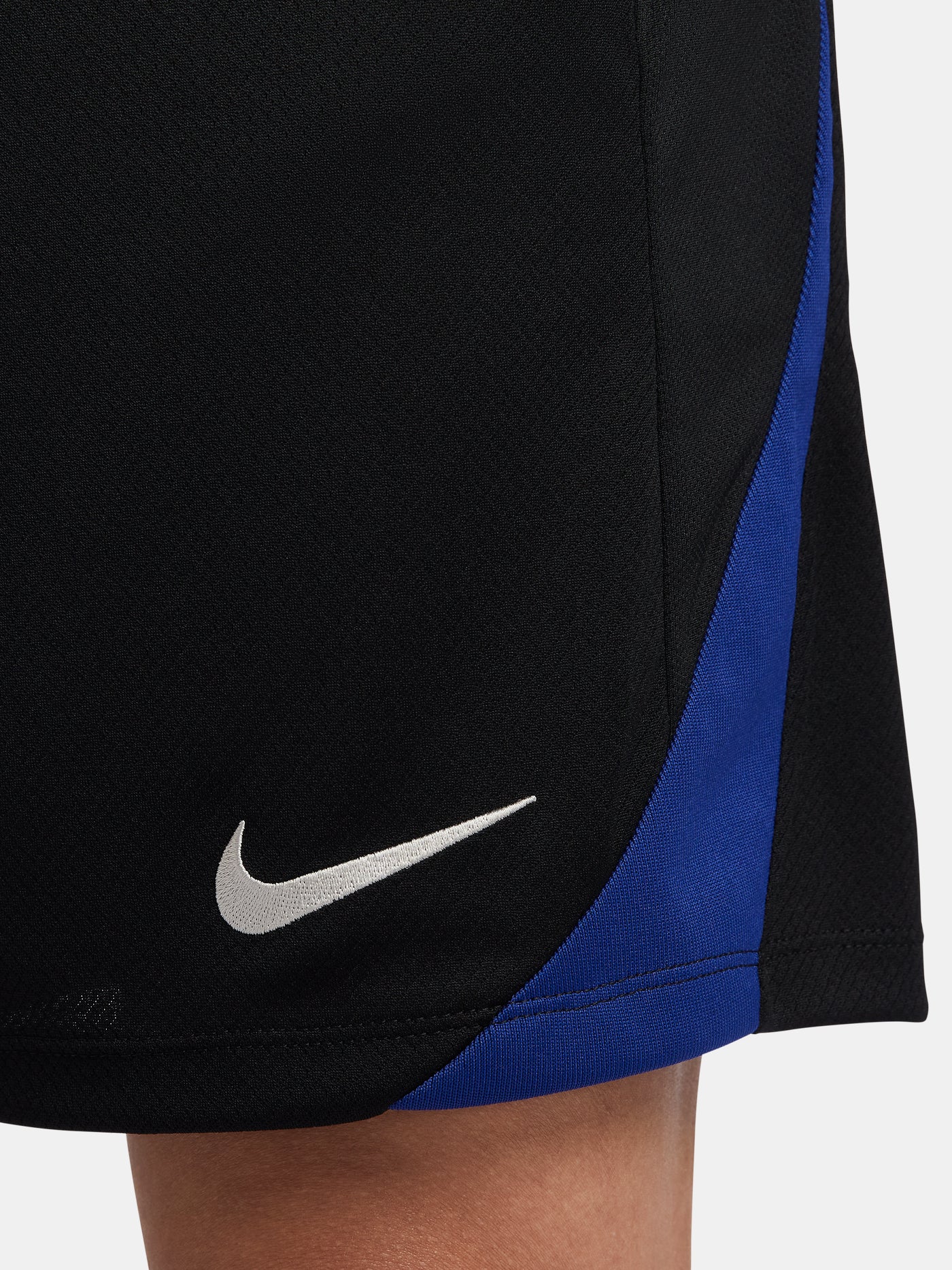 Black FC Barcelona shorts with blue and red side accents, Nike logo and club crest.