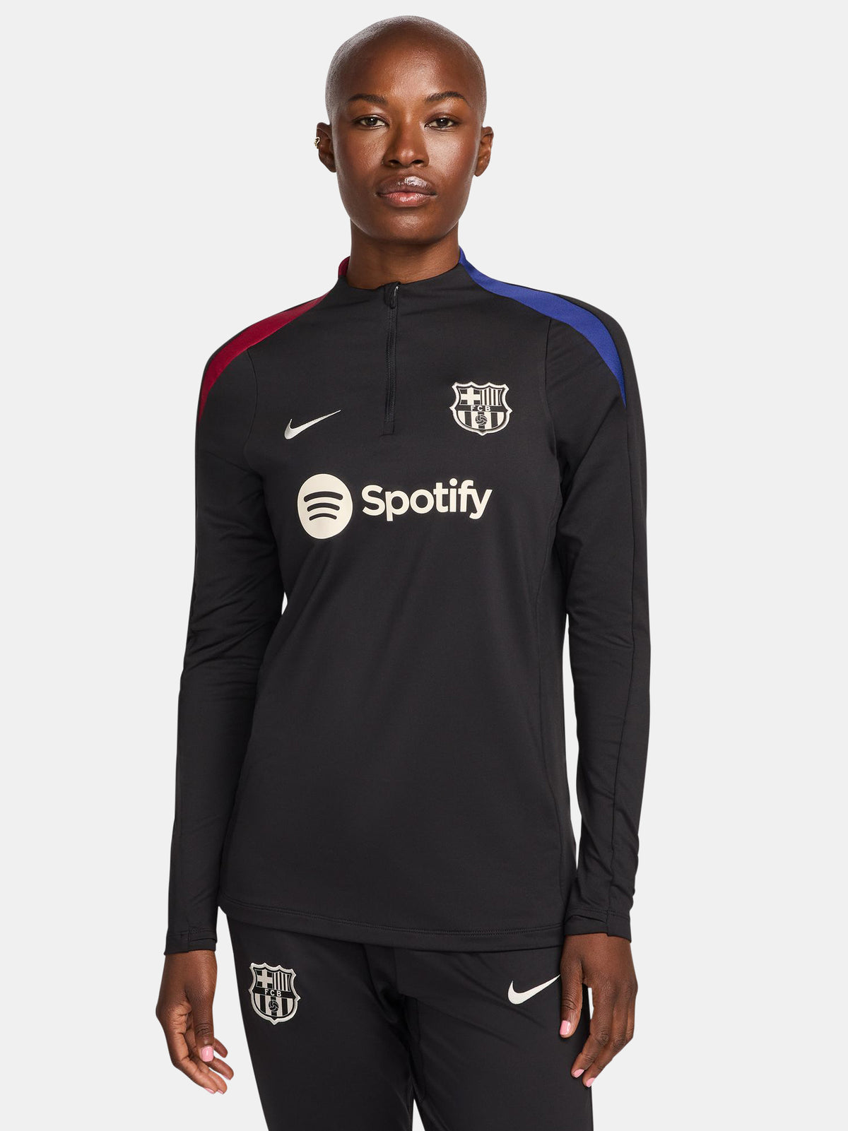 FC Barcelona black long-sleeve training top with white crest, Spotify logo, and red-blue shoulder accents.
