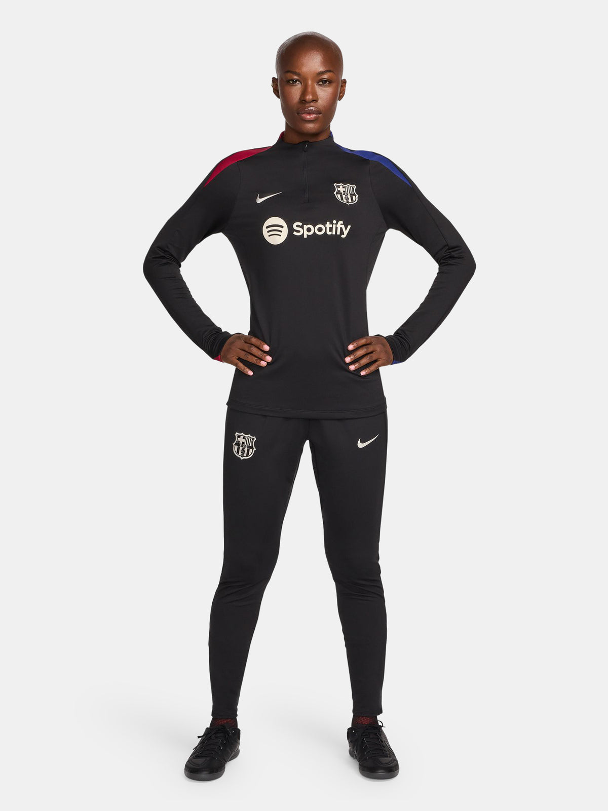 FC Barcelona black long-sleeve training top with white crest, Spotify logo, and red-blue shoulder accents.