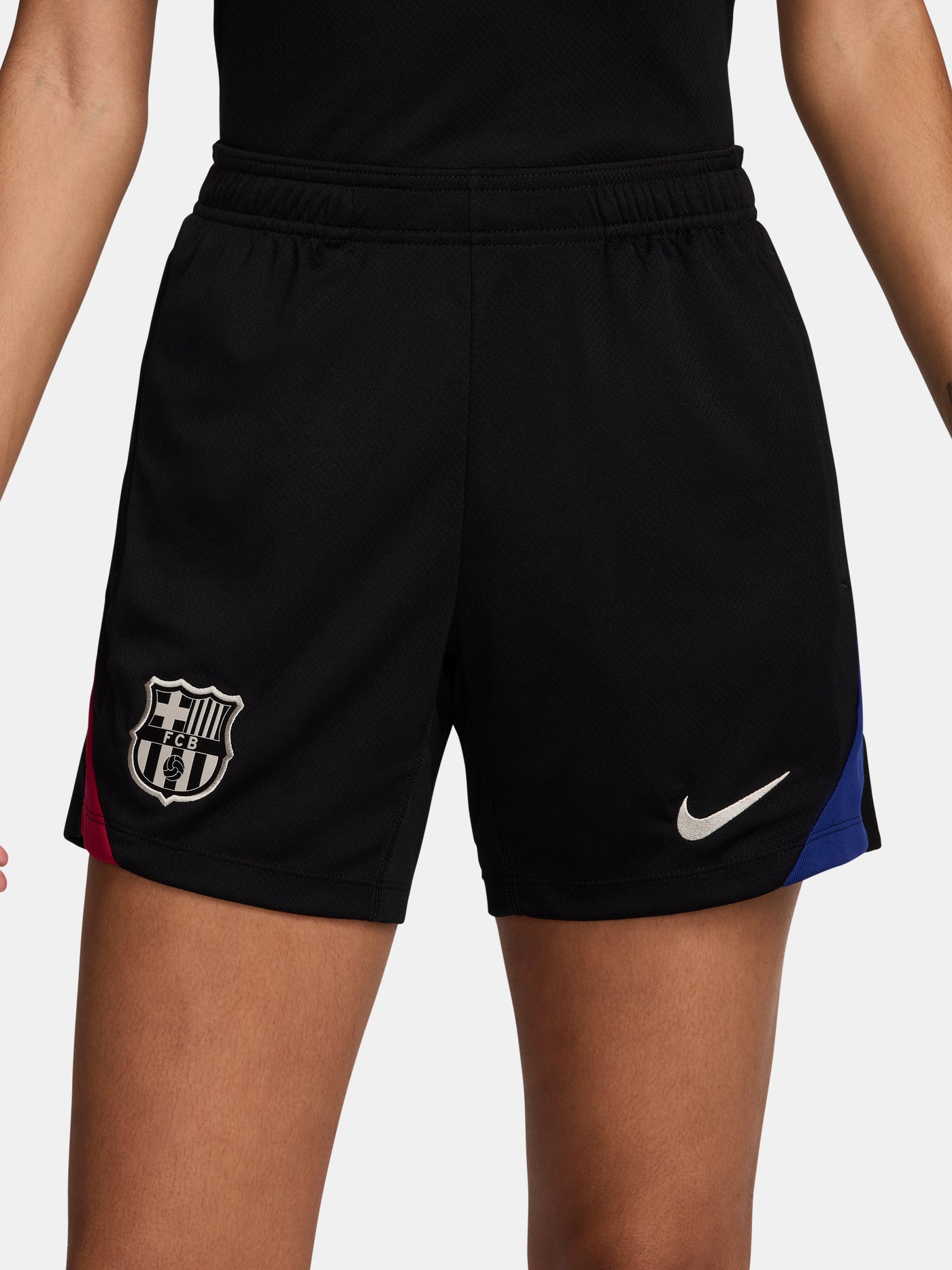 FC Barcelona black shorts with white crest, Nike logo, and red-blue side accents.