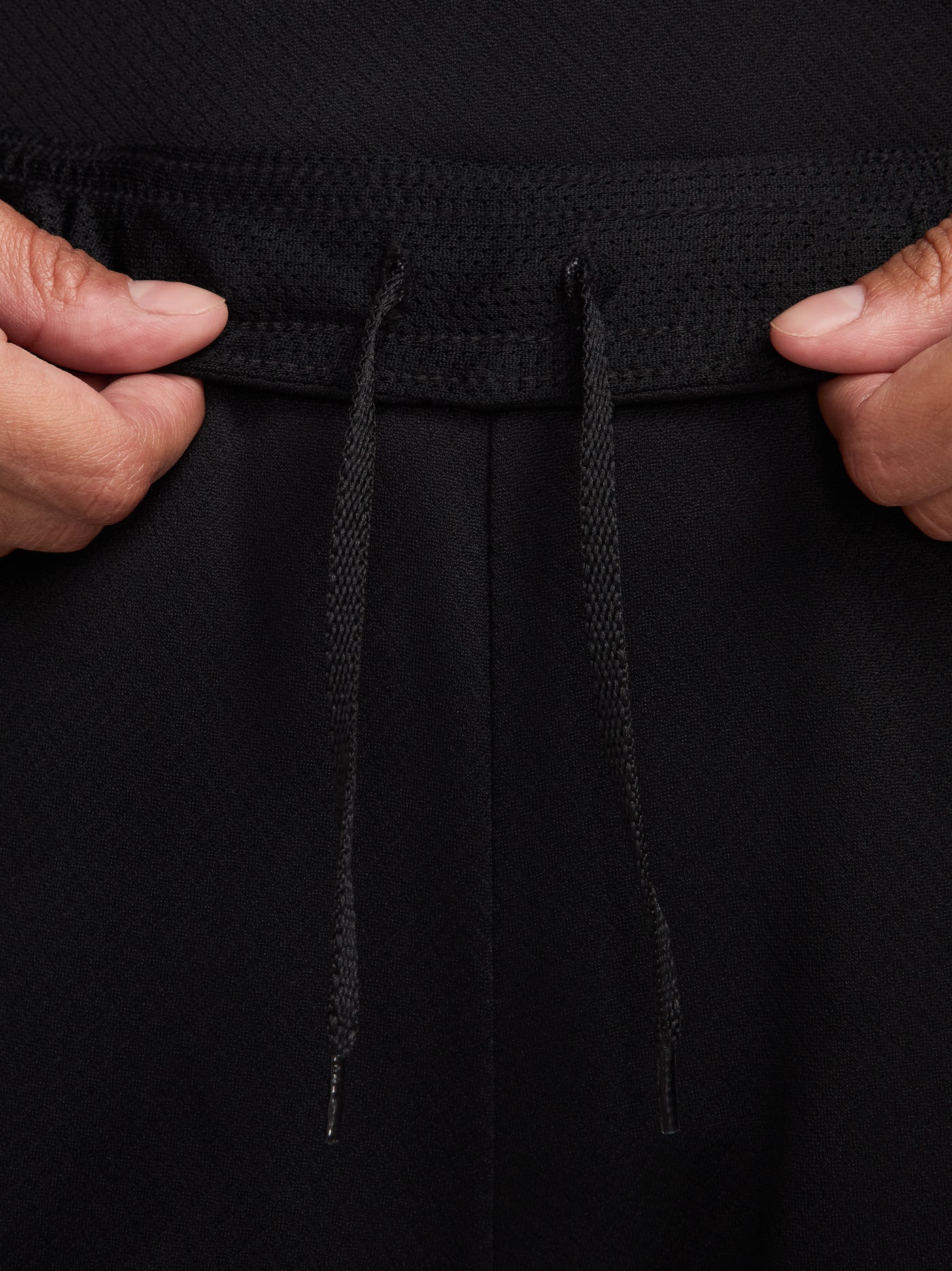 FC Barcelona black shorts with white crest, Nike logo, and red-blue side accents.