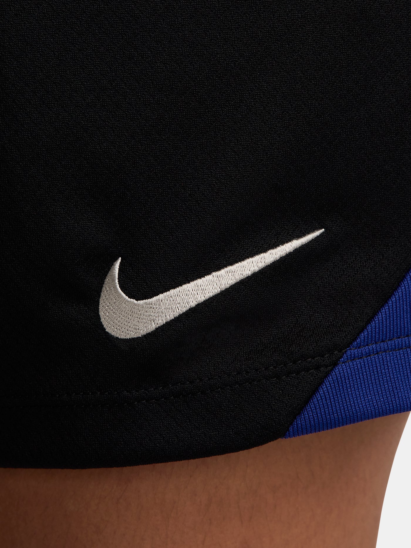 FC Barcelona black shorts with white crest, Nike logo, and red-blue side accents.