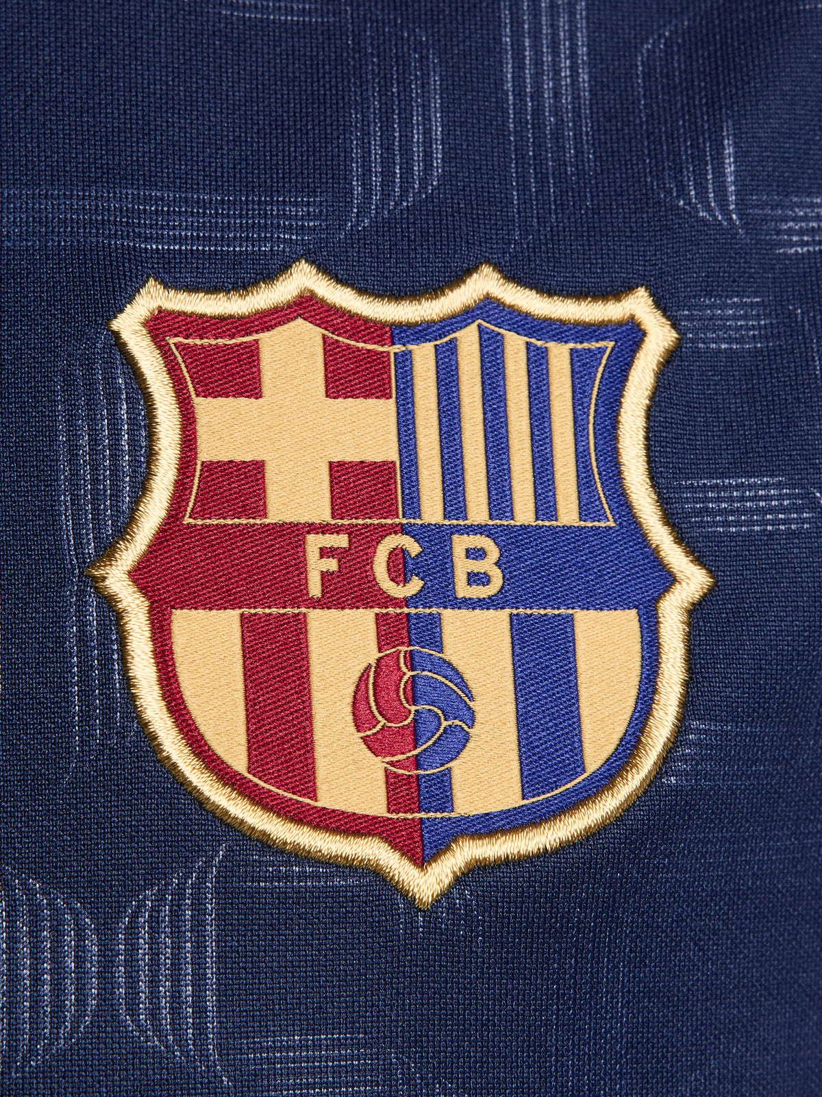 FC Barcelona warm-up shirt featuring a black base with a striking vertical stripe pattern in alternating red and blue. The shirt displays the red Spotify logo in the center, along with the Nike swoosh and FC Barcelona crest, also in red.