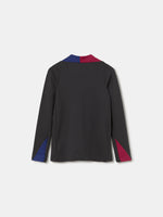 FC Barcelona black long-sleeve youth training top with white crest and central Spotify logo, red and blue shoulder panels.