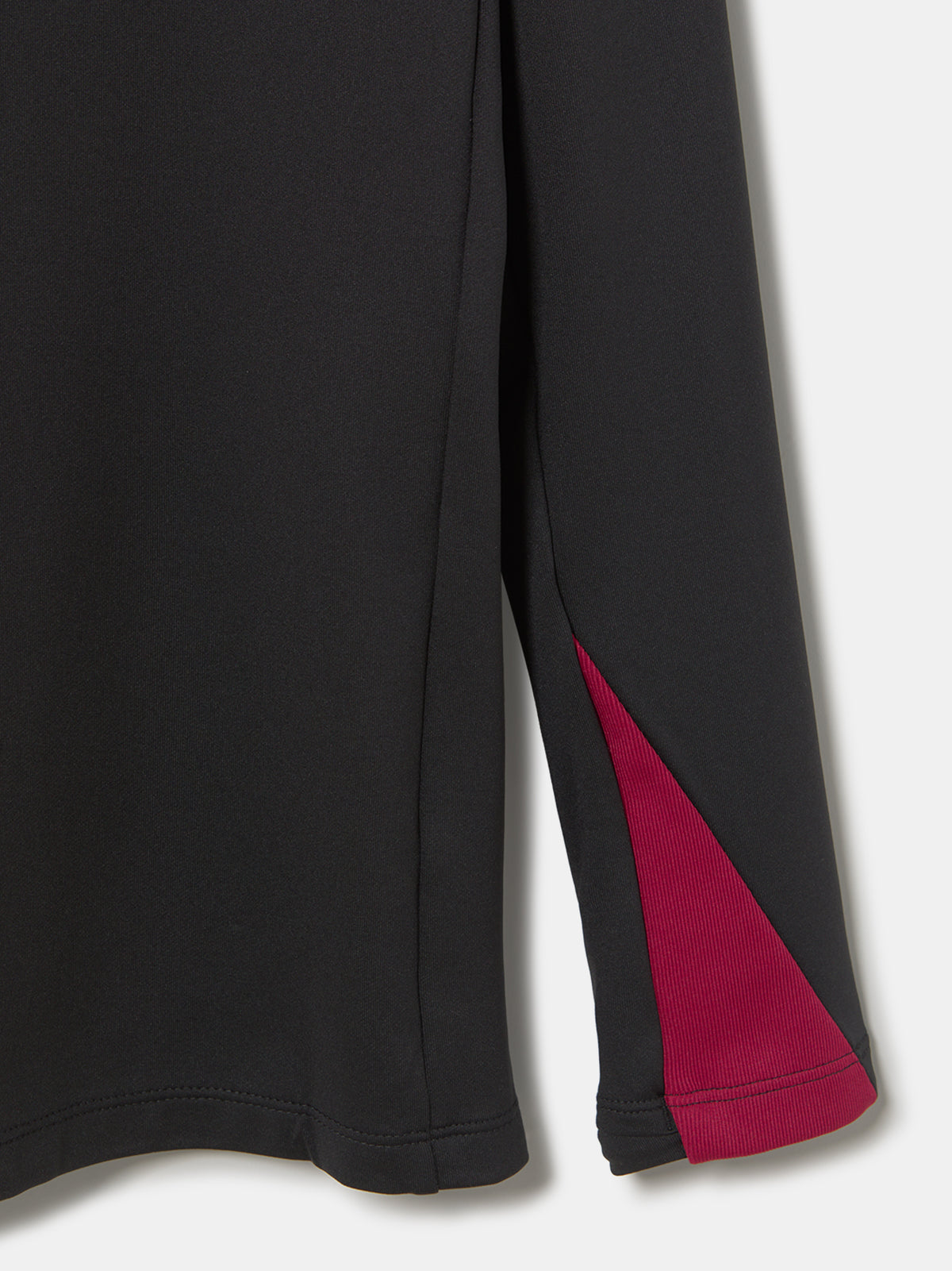 FC Barcelona black long-sleeve youth training top with white crest and central Spotify logo, red and blue shoulder panels.