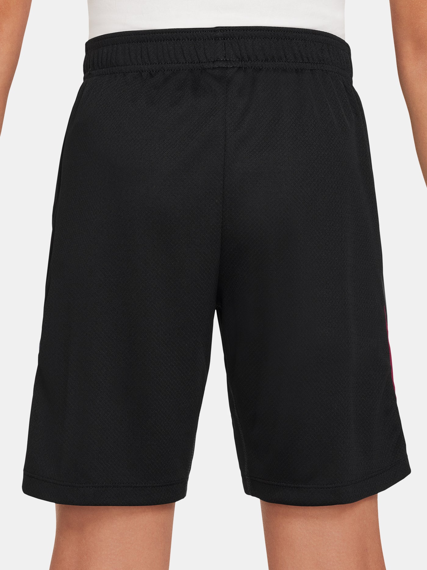 FC Barcelona kids' black shorts with white crest, Nike logo, and red-blue side accents.