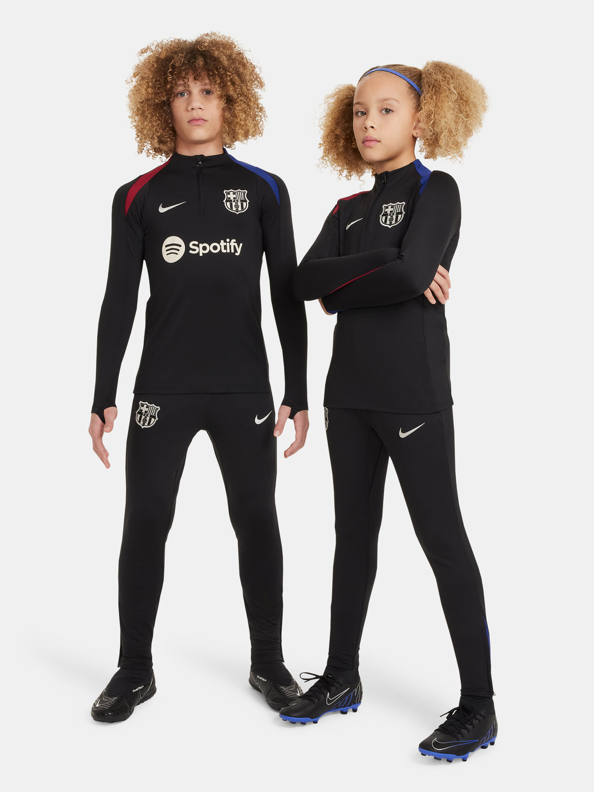 Black FC Barcelona training pants with beige crest and Nike logo.