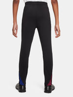 Black FC Barcelona training pants with beige crest and Nike logo.