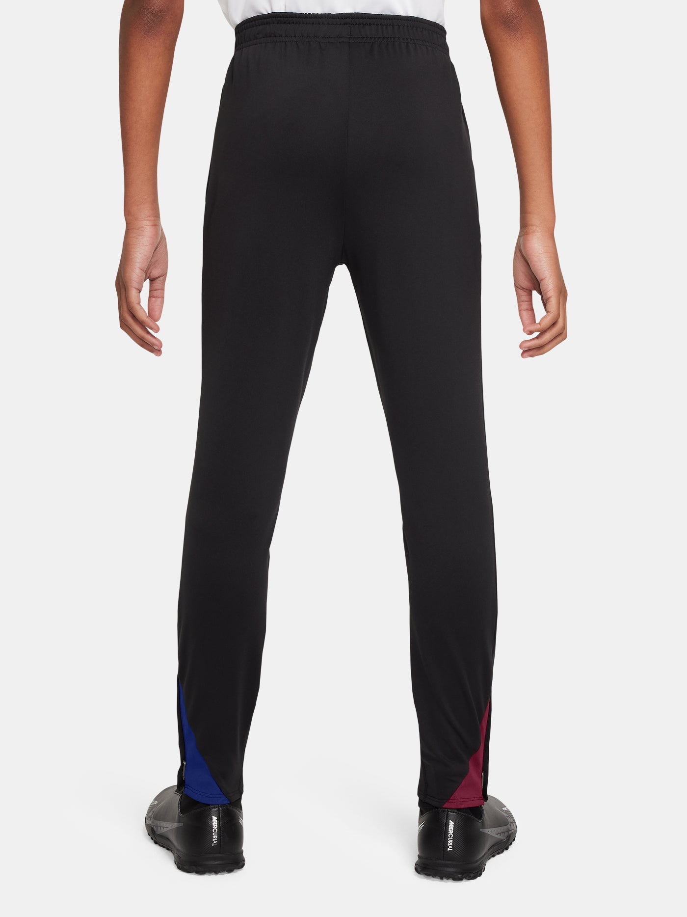 Black FC Barcelona training pants with beige crest and Nike logo.