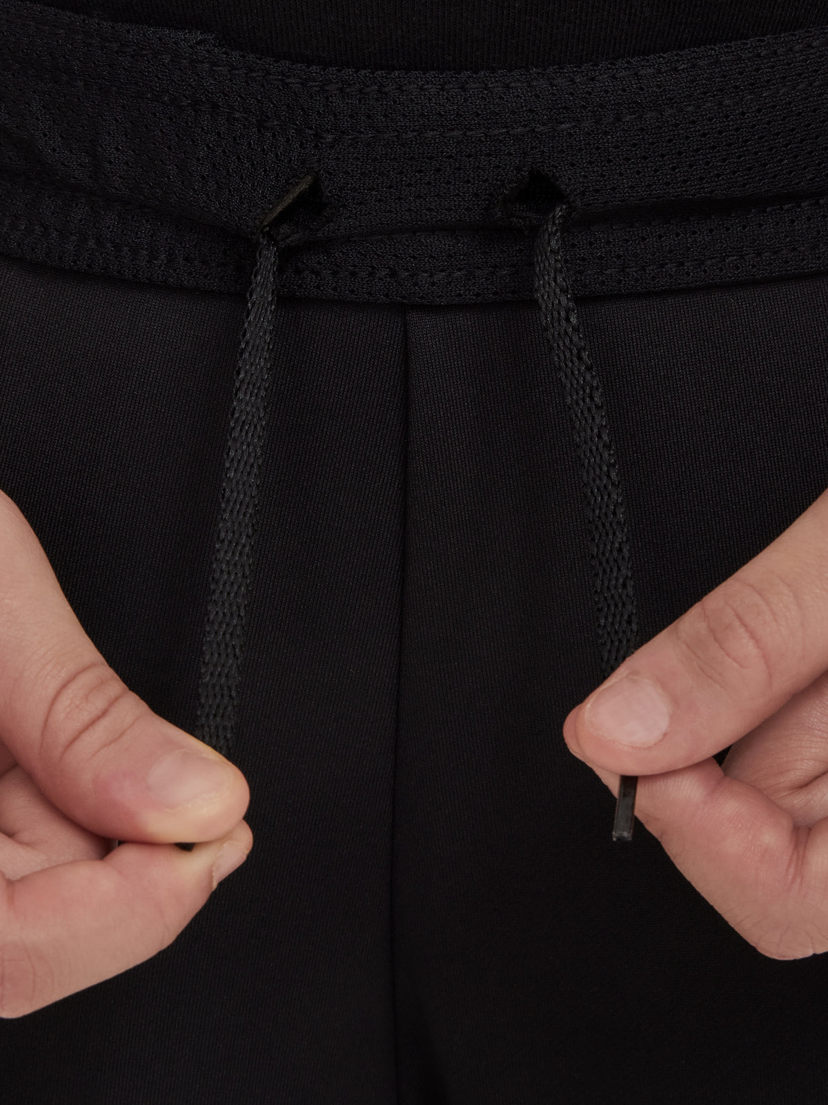 Black FC Barcelona training pants with beige crest and Nike logo.