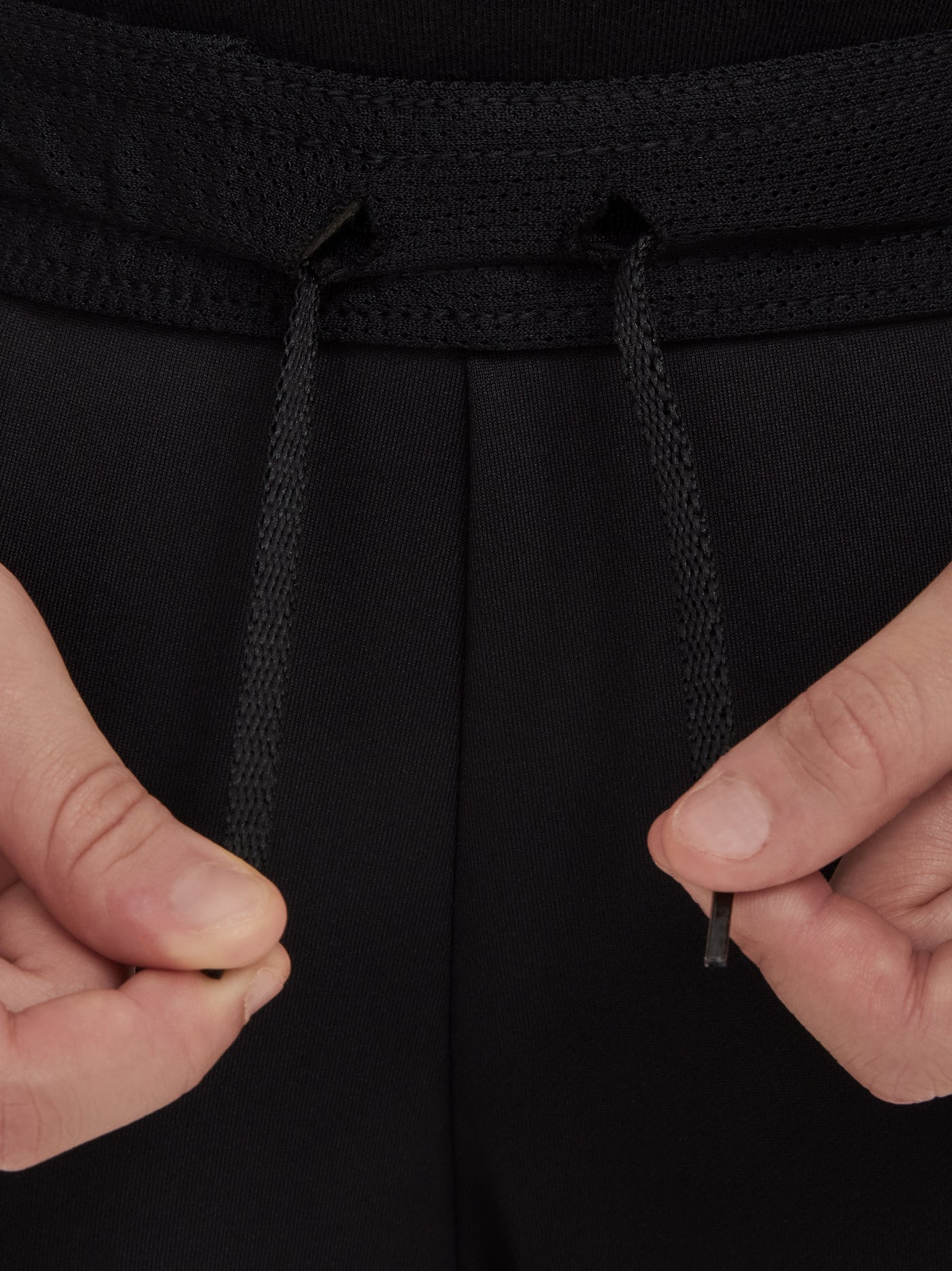 Black FC Barcelona training pants with beige crest and Nike logo.