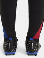 Black FC Barcelona training pants with beige crest and Nike logo.
