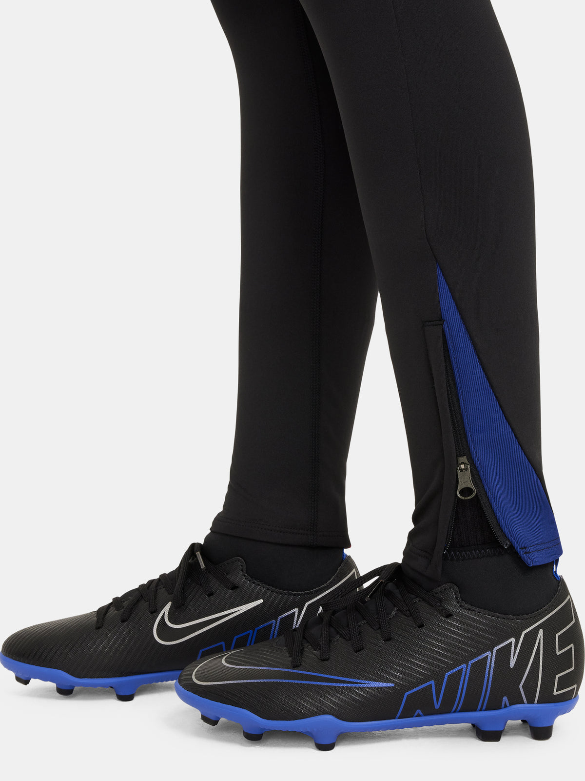 Black FC Barcelona training pants with beige crest and Nike logo.