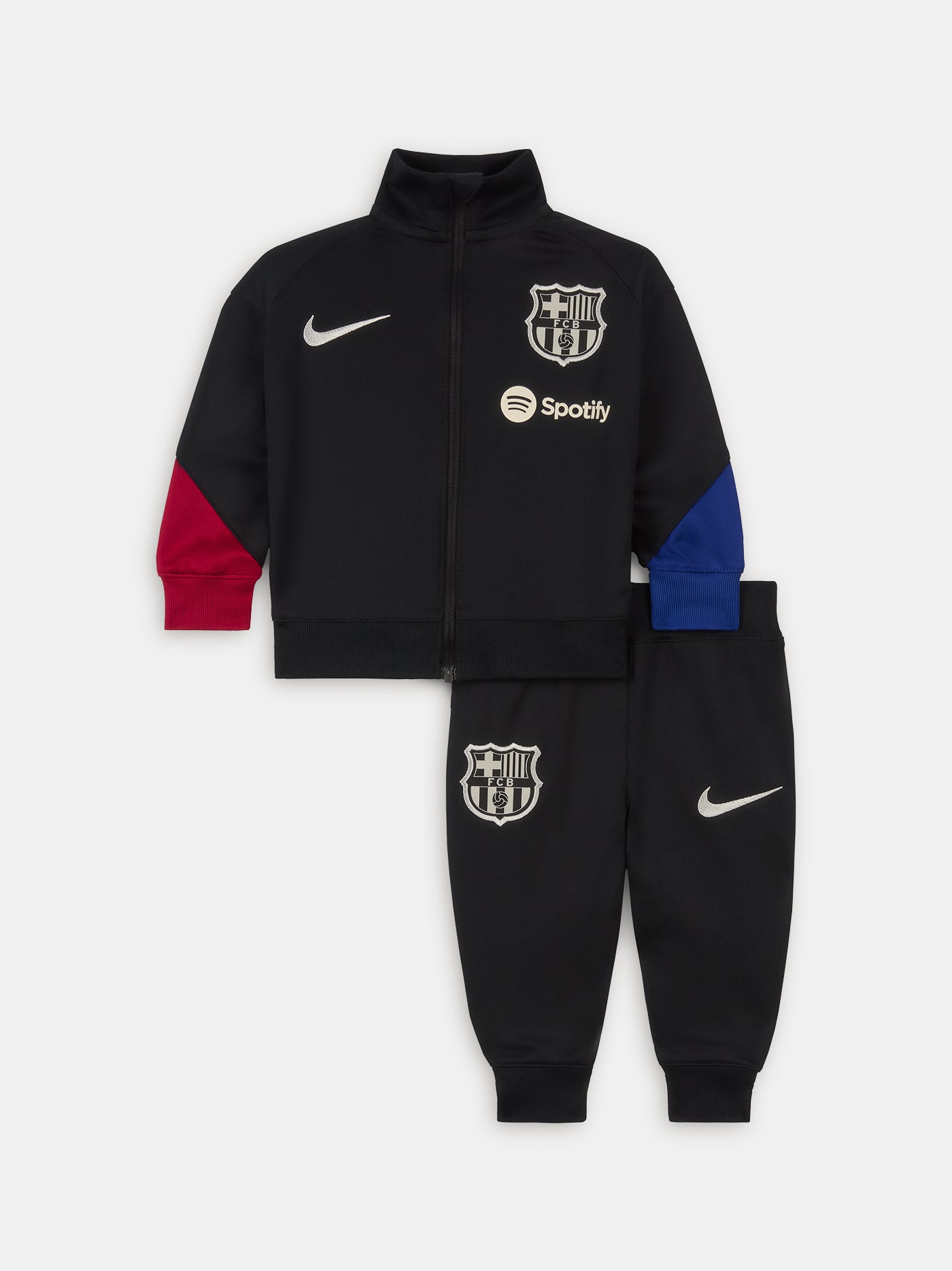 Black FC Barcelona tracksuit with red and blue sleeve cuffs, Nike logo and club crest.