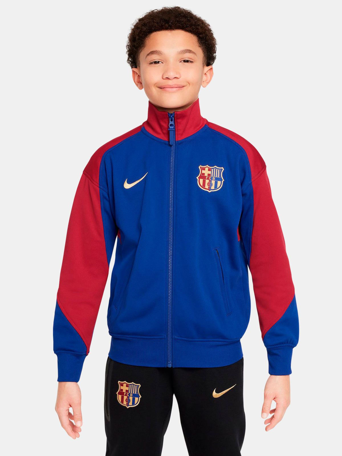 FC Barcelona retro-style jacket in blue and red with gold Nike logo and crest.
