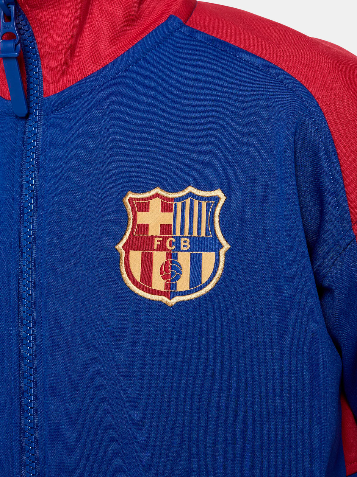 FC Barcelona retro-style jacket in blue and red with gold Nike logo and crest.
