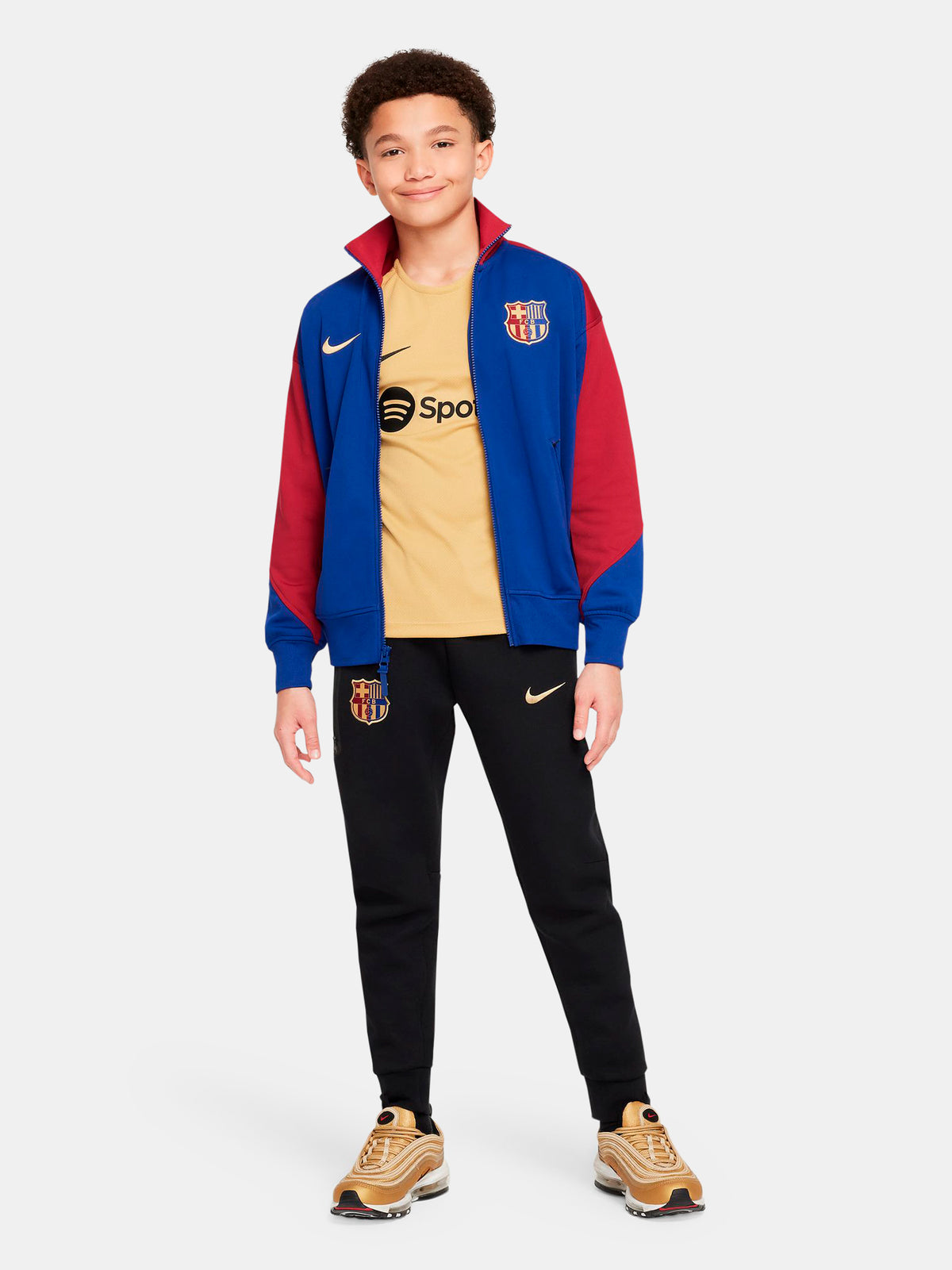FC Barcelona retro-style jacket in blue and red with gold Nike logo and crest.
