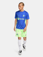 Blue and neon green FC Barcelona training jersey with Spotify and Nike logos.