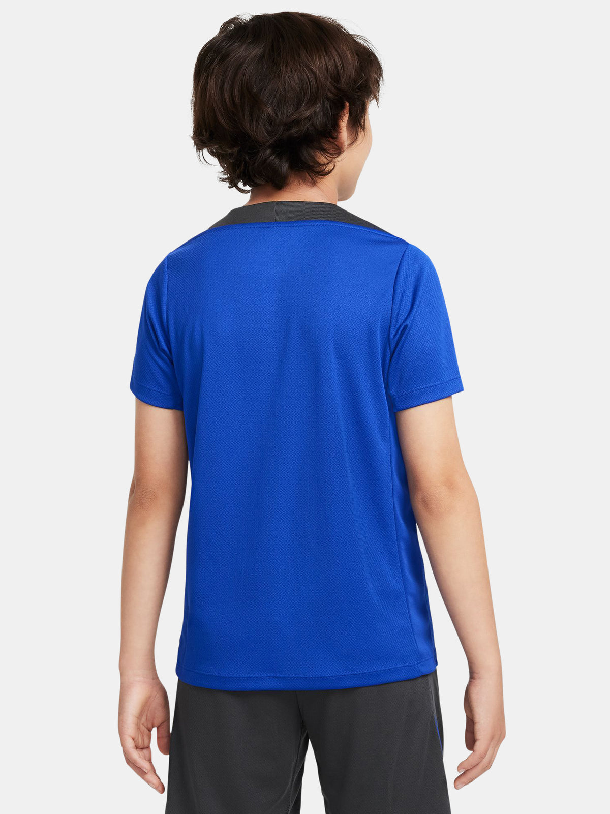 Blue FC Barcelona training jersey with neon green logos and black shoulder panels.