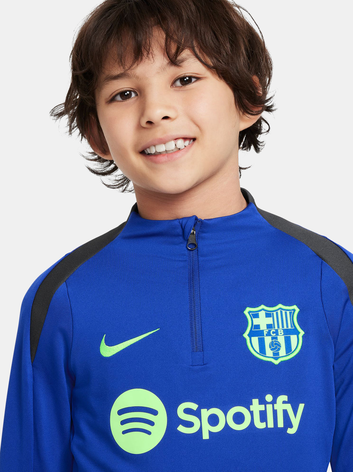 Blue FC Barcelona quarter-zip training top with neon green logos and black shoulder accents.