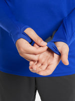 Blue FC Barcelona quarter-zip training top with neon green logos and black shoulder accents.