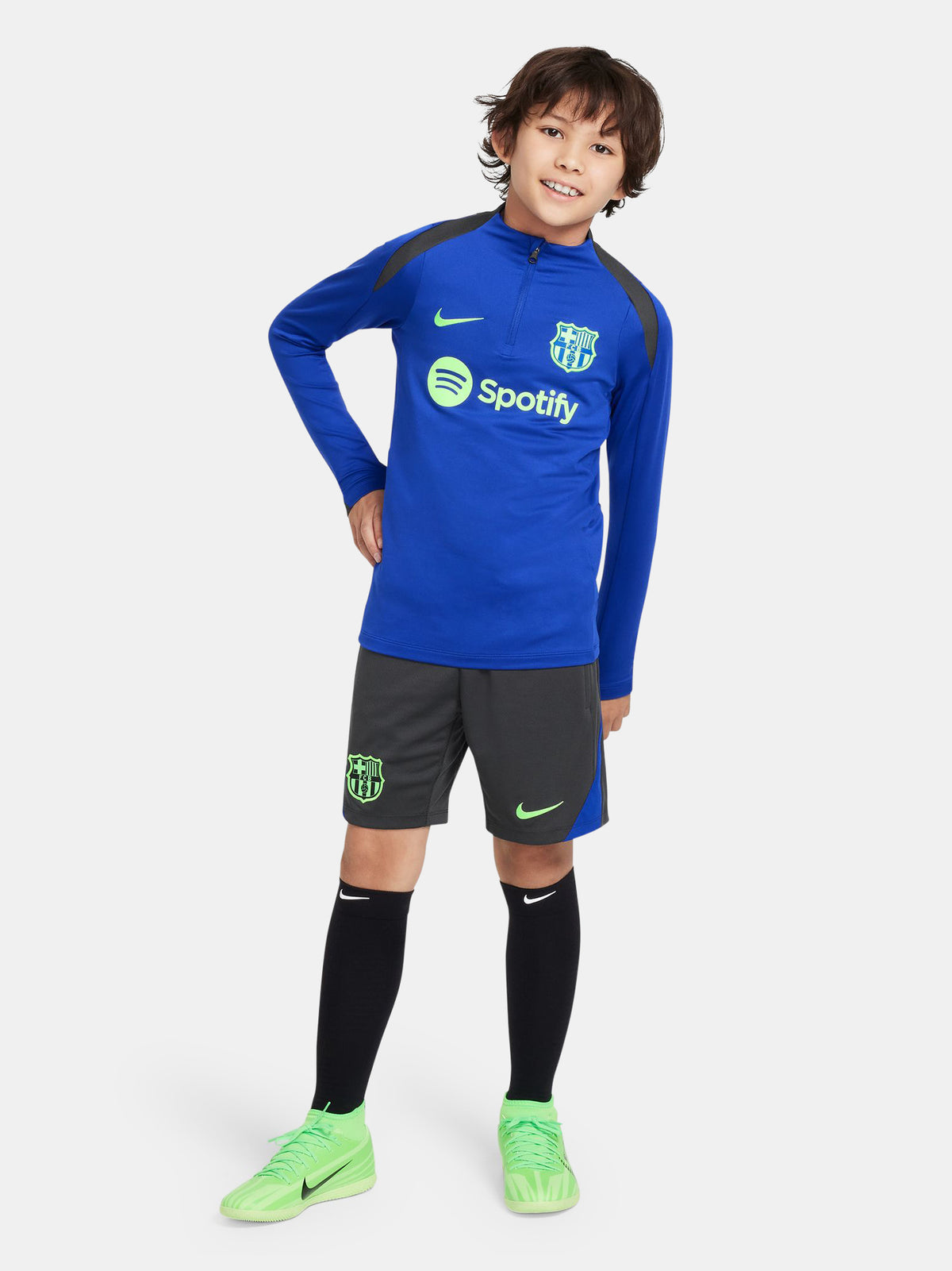 Blue FC Barcelona quarter-zip training top with neon green logos and black shoulder accents.