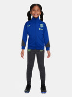 Kids' FC Barcelona tracksuit with blue jacket and black pants, featuring neon green crest and Nike logos.