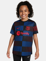 FC Barcelona warm-up shirt featuring a black base with a striking vertical stripe pattern in alternating red and blue. The shirt displays the red Spotify logo in the center, along with the Nike swoosh and FC Barcelona crest, also in red.