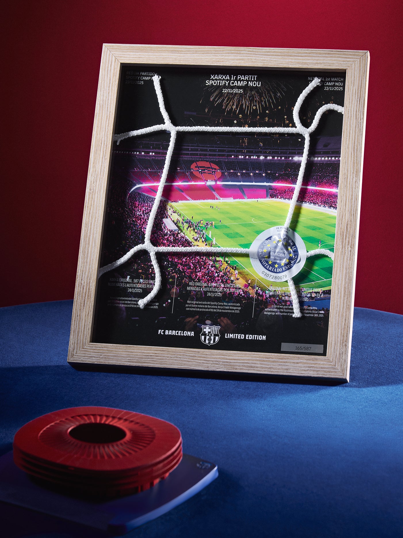Framed sports poster with a stadium graphic on a blue and red background