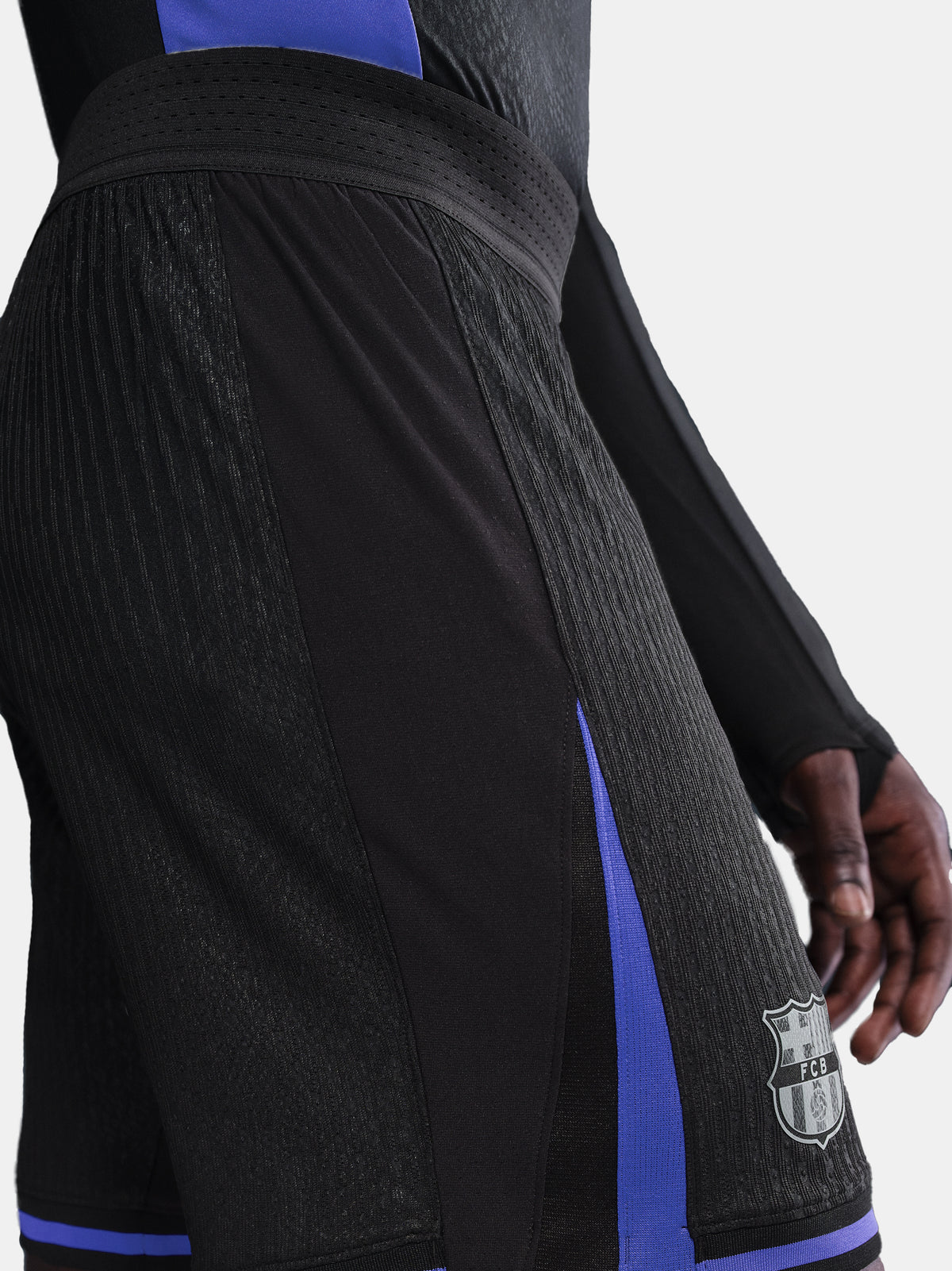 Black and blue sports shorts with a logo on a white background