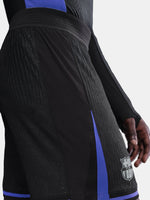 Black and blue sports shorts with a logo on a white background