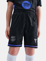 Black sports shorts with logos on a plain background