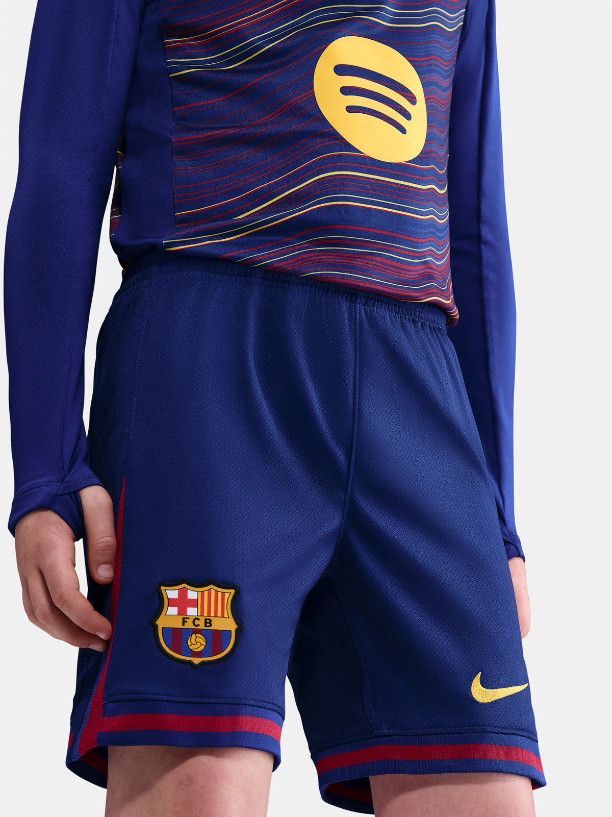 Classic Barça shorts in deep navy with red accents and yellow swoosh. Game-ready essentials.
