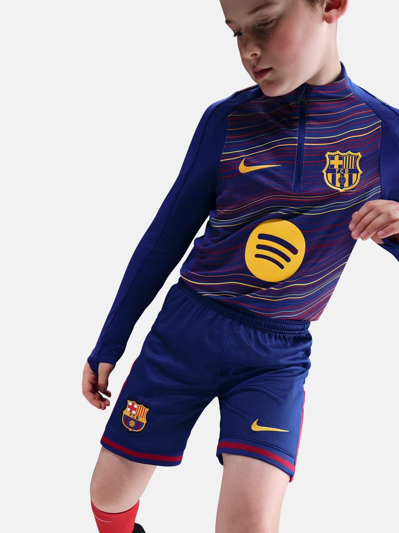 Classic Barça shorts in deep navy with red accents and yellow swoosh. Game-ready essentials.
