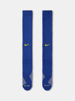 Blue Nike sock with yellow swoosh logo on a white background